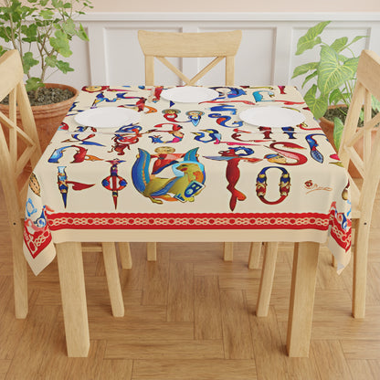 Armenian bird letter square tablecloth on a wooden dining table set with plates