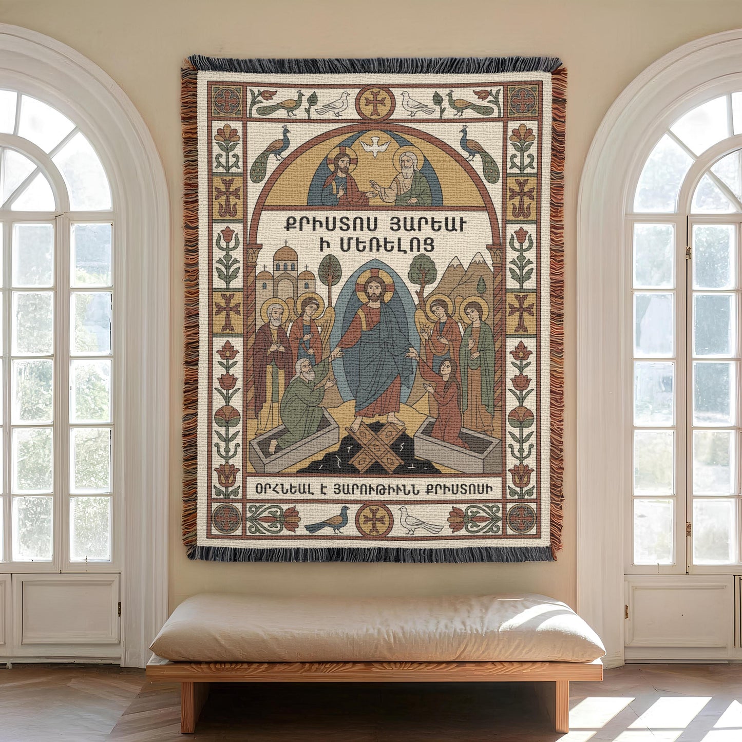 Tall arched windows flank Virgin Mary wall tapestry, bench beneath, ornamental borders and Armenian cross motifs visible.