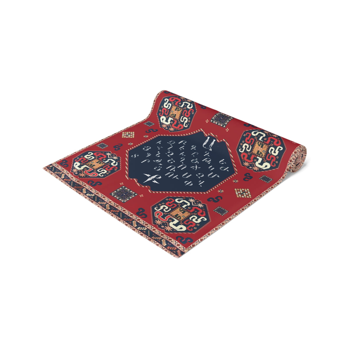 Armenian alphabet table runner in deep red on a dining table set with white plates and glasses