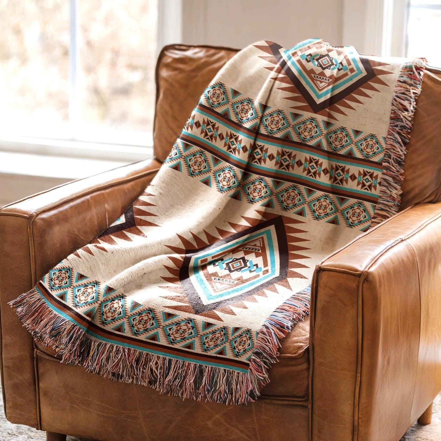 Southwestern woven blanket with geometric pattern styled for layered home decor