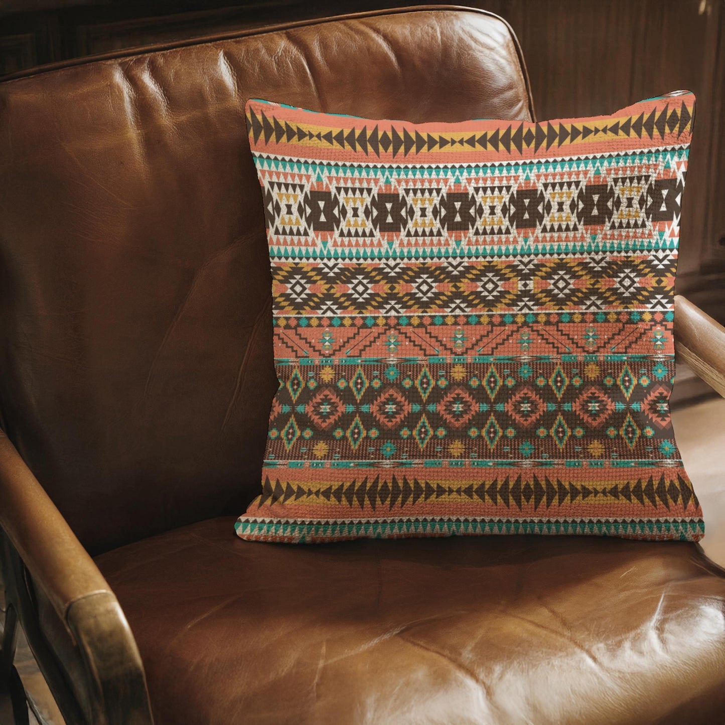 Southwestern throw pillow with geometric pattern styled on a sofa or bed