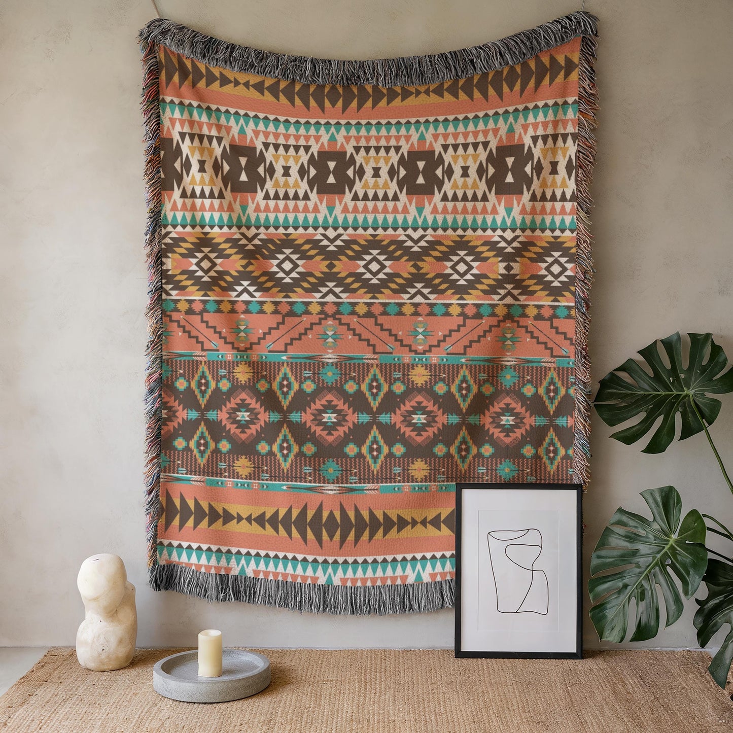 a vibrant, patterned tapestry hanging on a wall, accompanied by a framed artwork and a candle on a table.