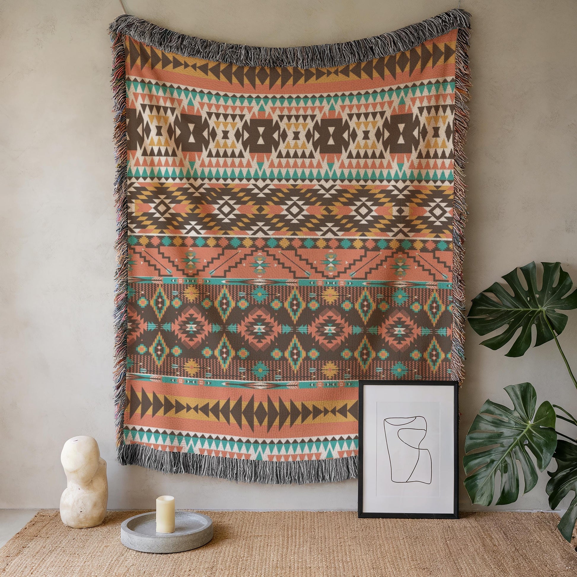 a vibrant, patterned tapestry hanging on a wall, accompanied by a framed artwork and a candle on a table.