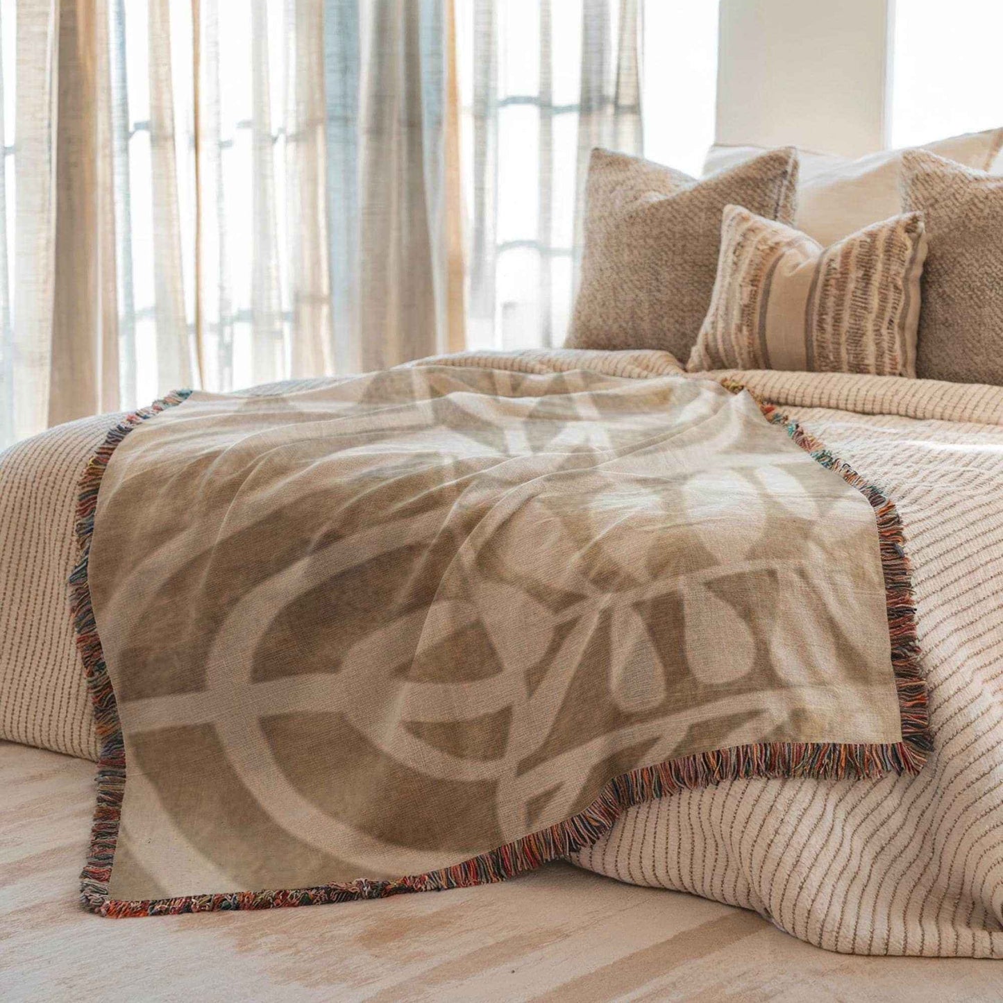 Modern Geometric woven blanket with geometric pattern styled for layered home decor
