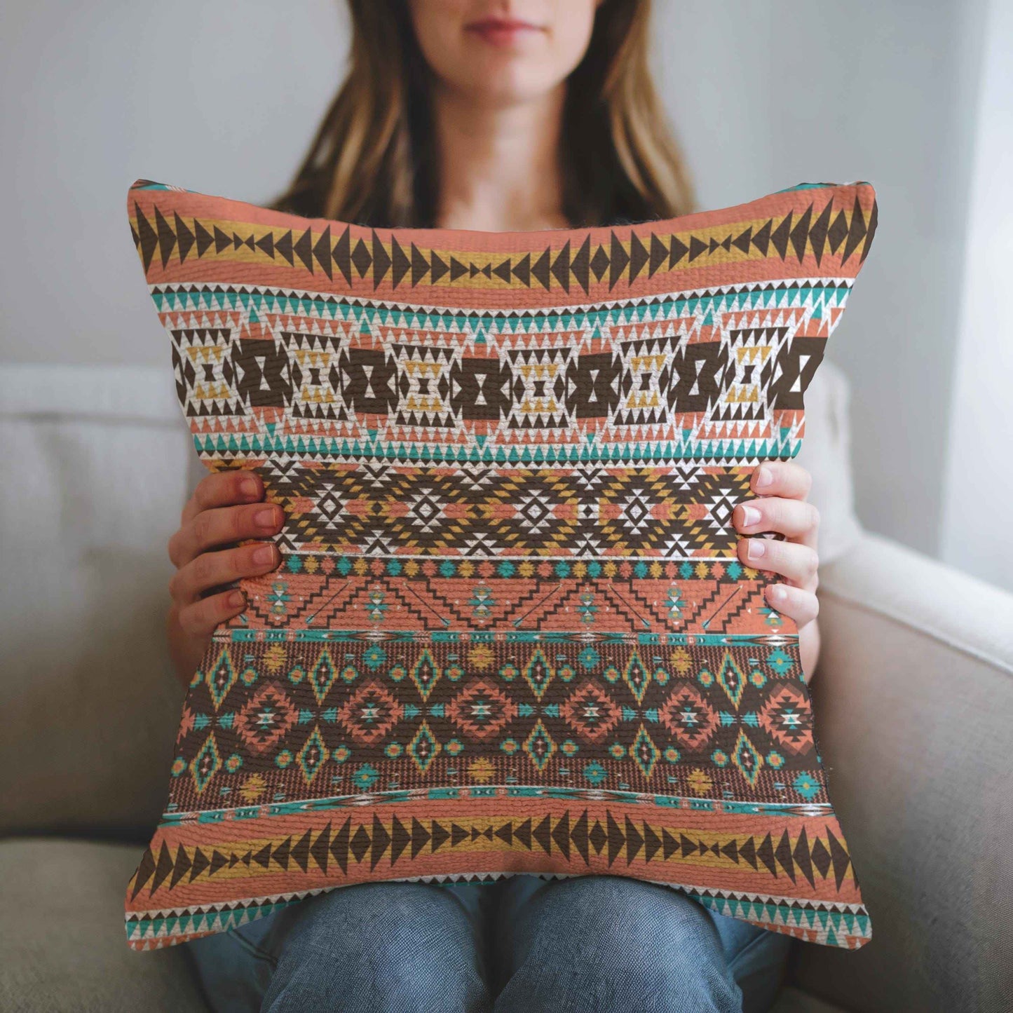 Southwestern throw pillow with geometric pattern styled on a sofa or bed
