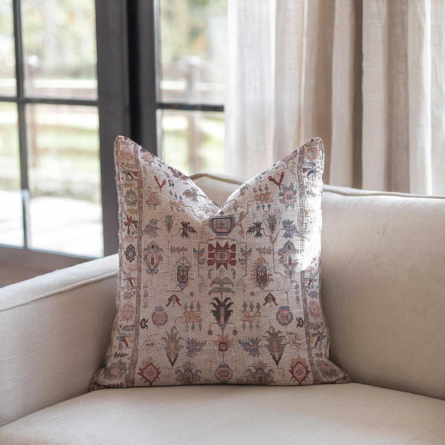 Anatolian Inspired pillow cover with rug-style pattern styled on a sofa or bed
