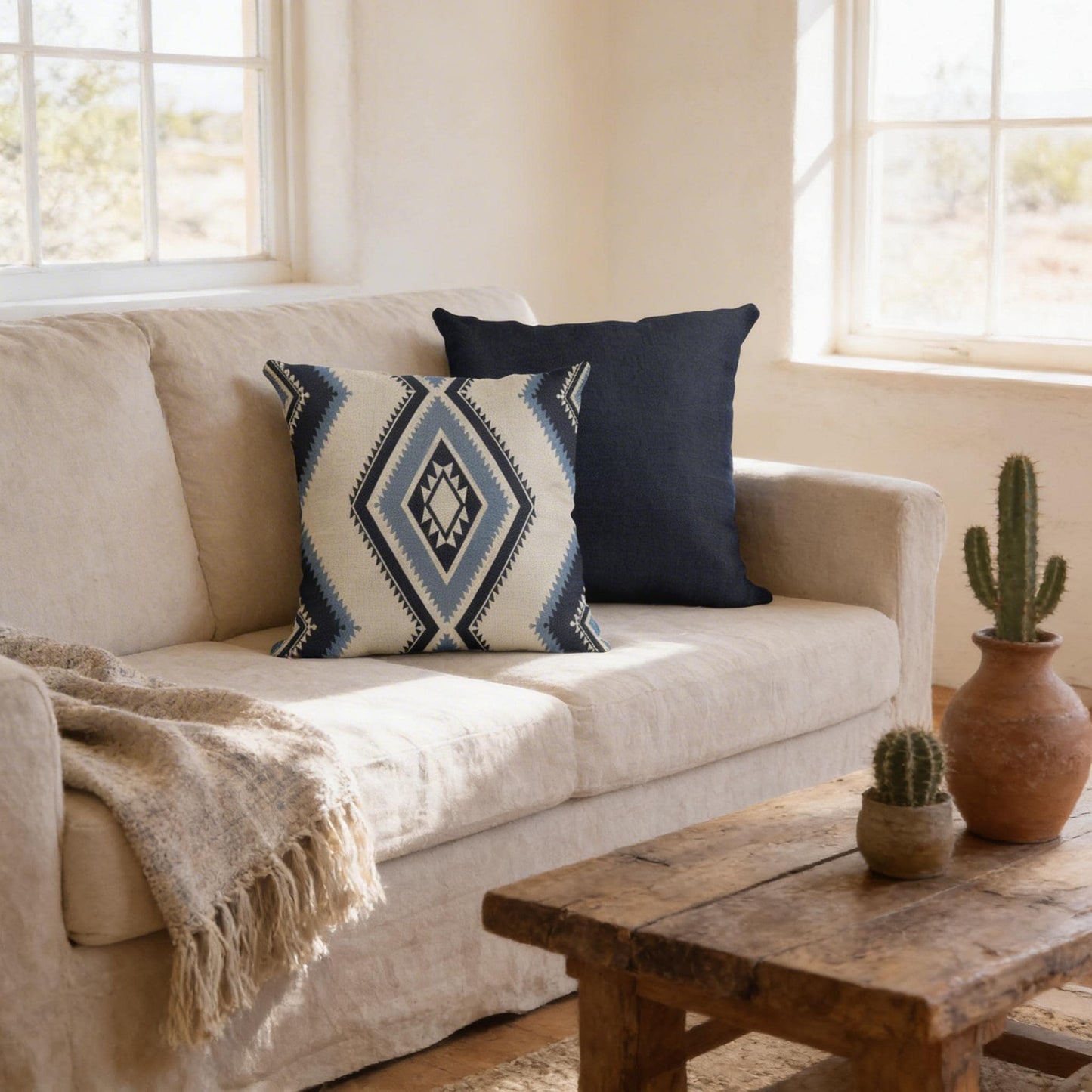 Southwestern pillow cover with geometric pattern styled on a sofa or bed