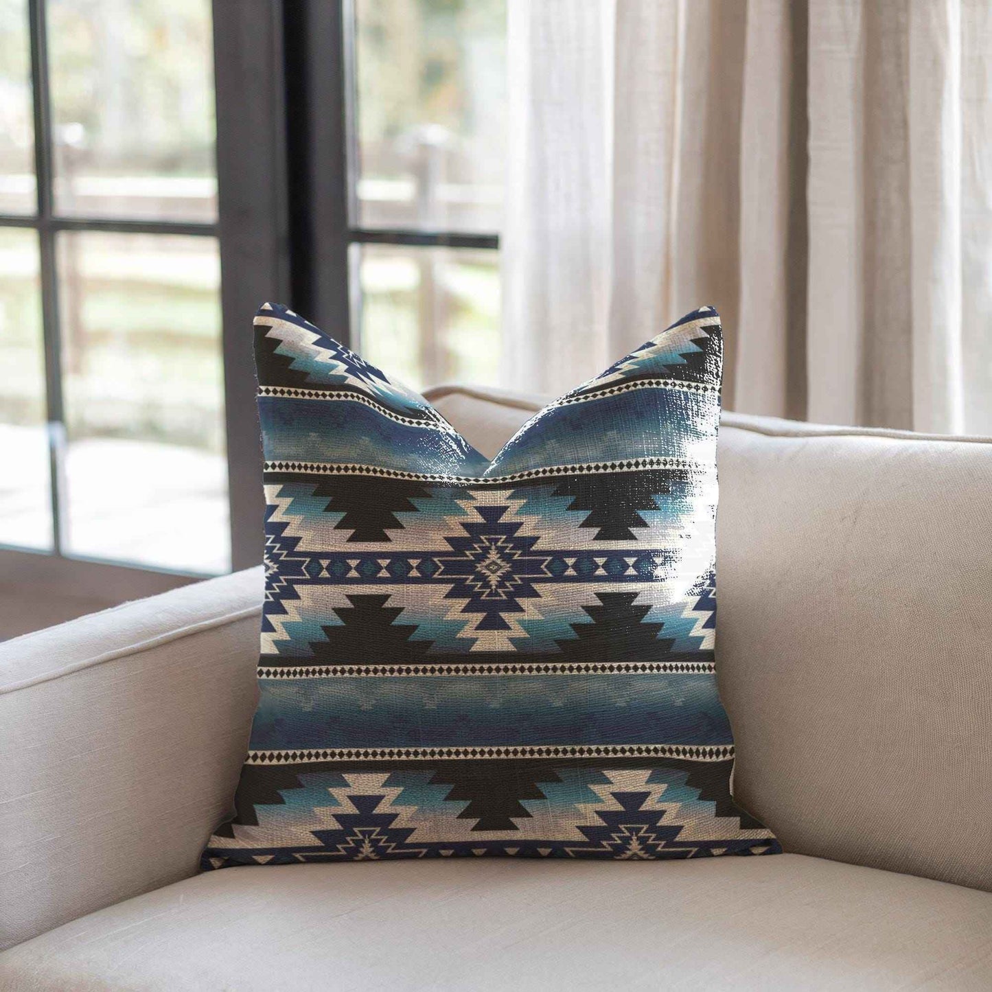 Southwestern throw pillow with geometric pattern styled on a sofa or bed