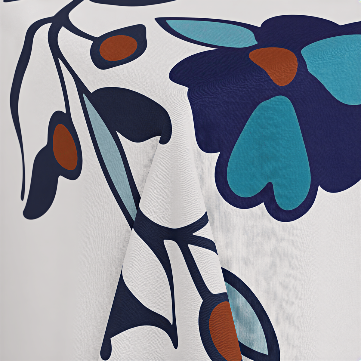Close view of the teal and navy flowers with rust berries and blue-grey leaves on white