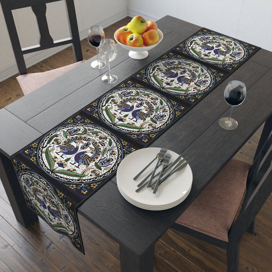 Armenian peacock table runner in dark navy on a dining table with wooden chairs and a bowl of fruit