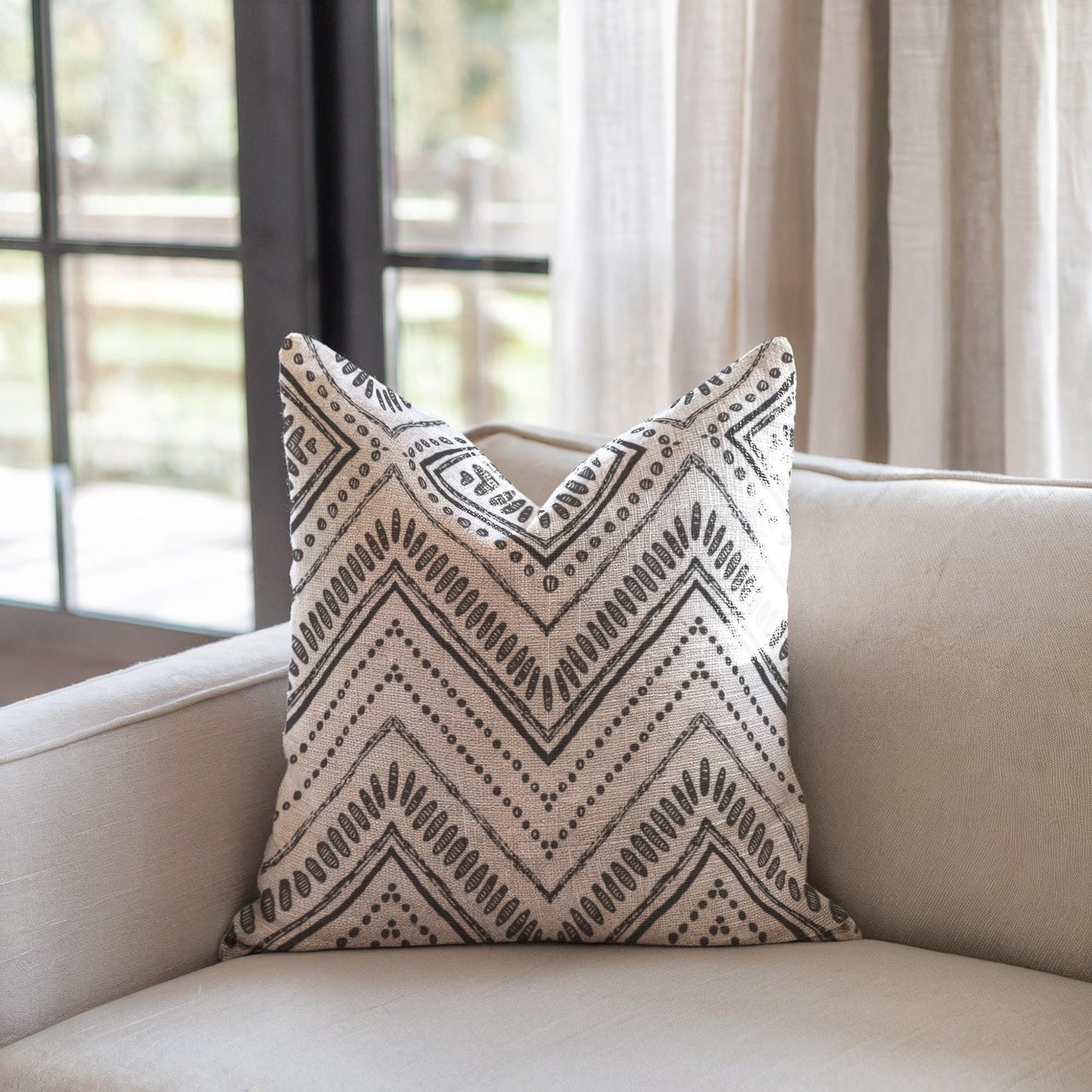 Modern Geometric pillow cover with geometric pattern styled on a sofa or bed