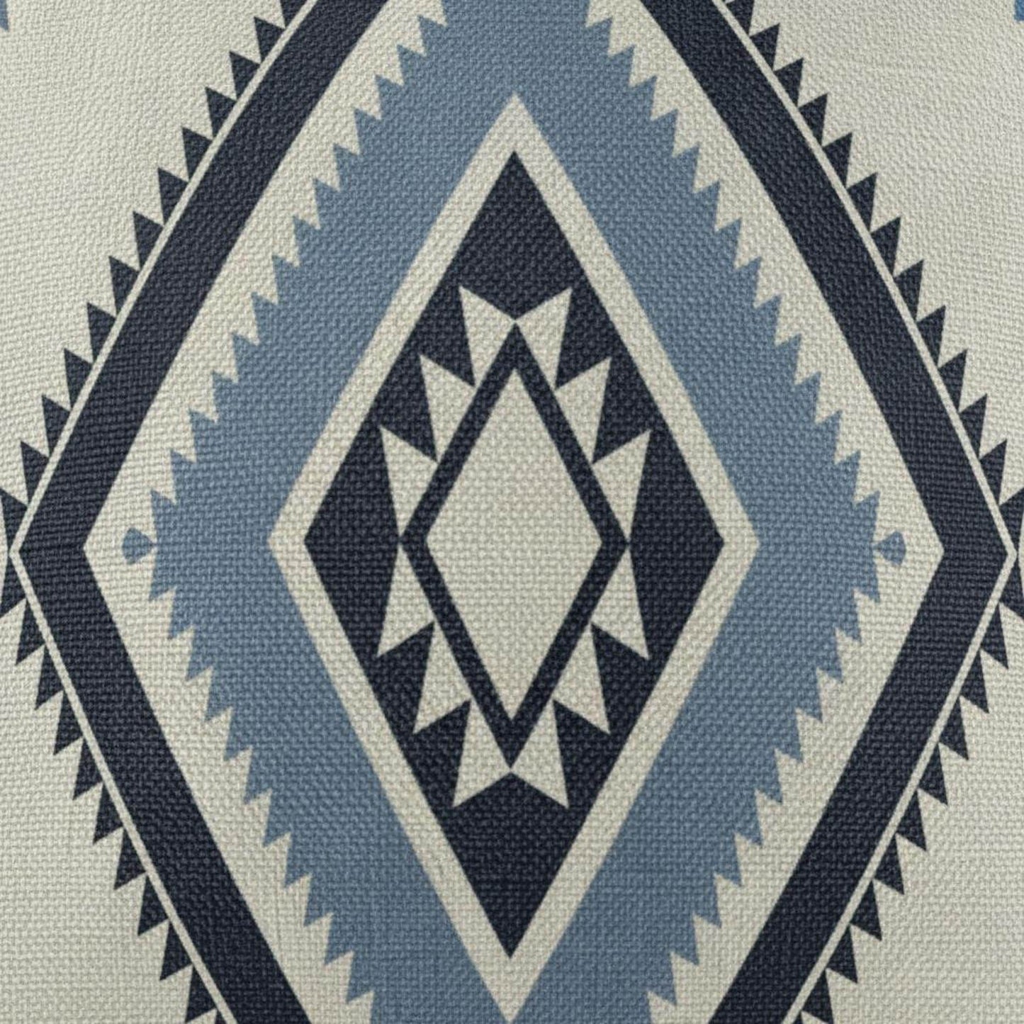 Southwestern pillow cover with geometric pattern styled on a sofa or bed