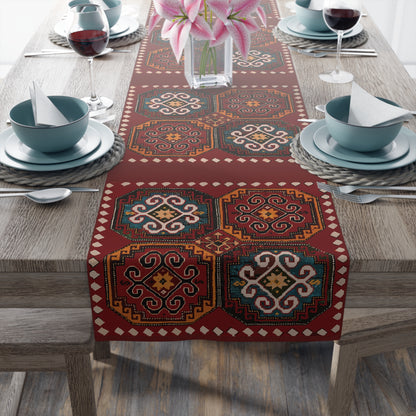 Anatolian Armenian carpet table runner in deep red on a dining table set with white plates and glasses