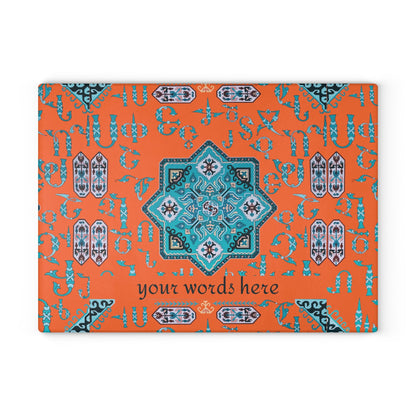 Orange and turquoise Armenian cutting board on a wooden worktop with a knife alongside