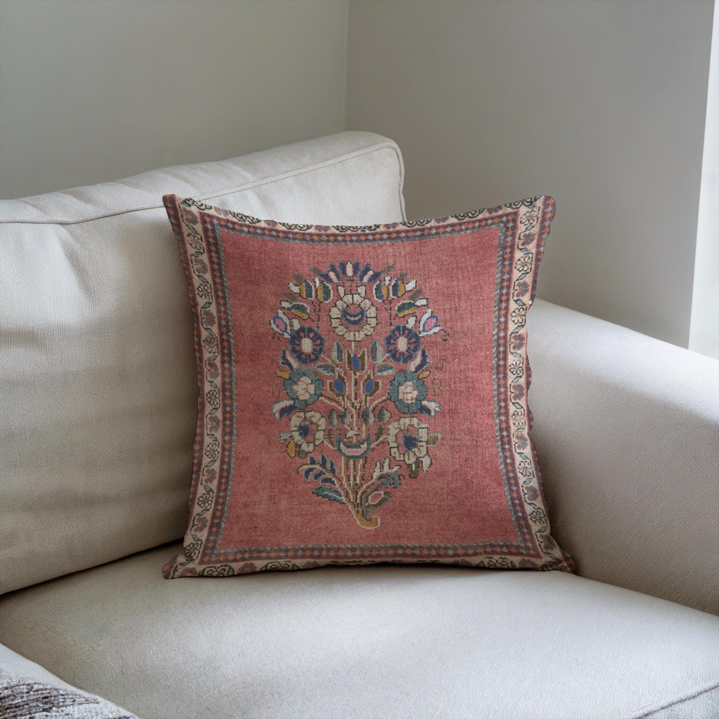 Anatolian Inspired throw pillow with floral pattern styled on a sofa or bed