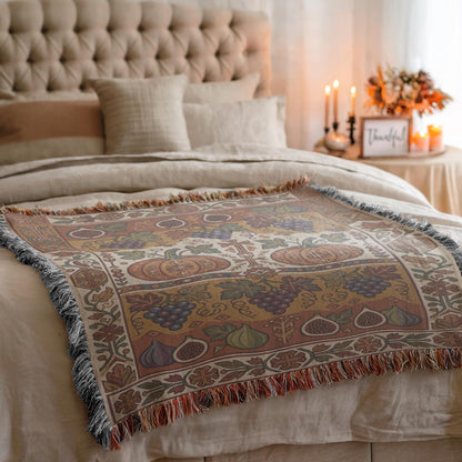 Grape and fig Armenian woven blanket layered on a bed with a tufted headboard