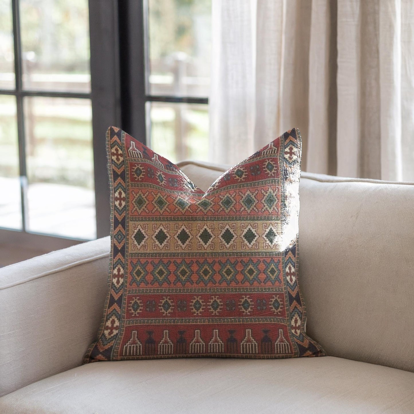 Anatolian Inspired pillow cover with rug-style pattern styled on a sofa or bed