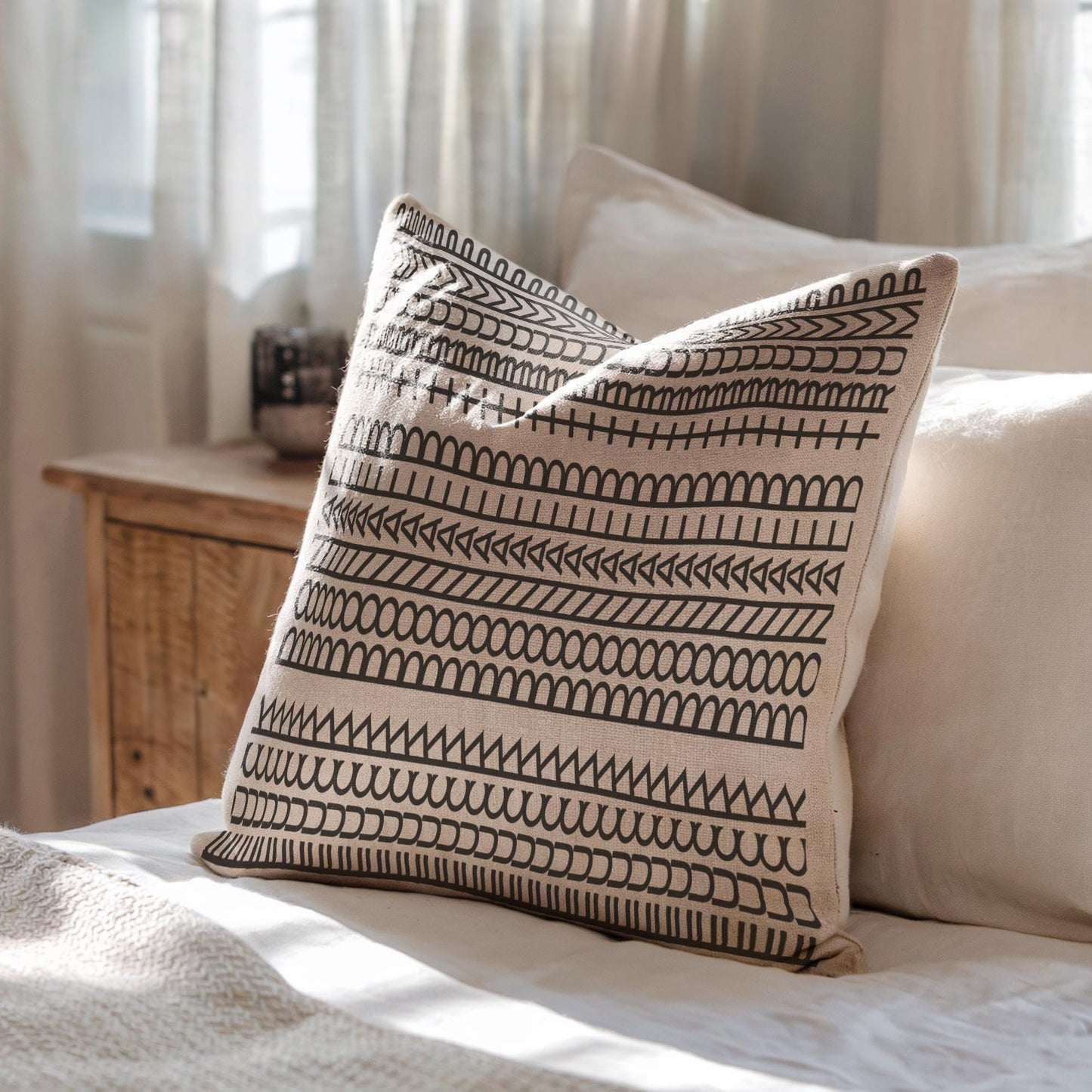 Modern Geometric throw pillow with geometric pattern styled on a sofa or bed
