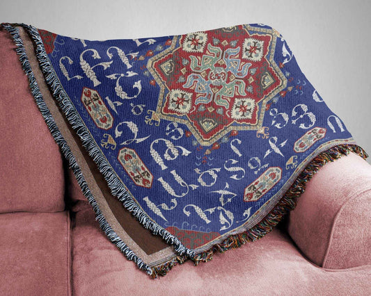 Boho woven blanket with woven pattern styled for layered home decor