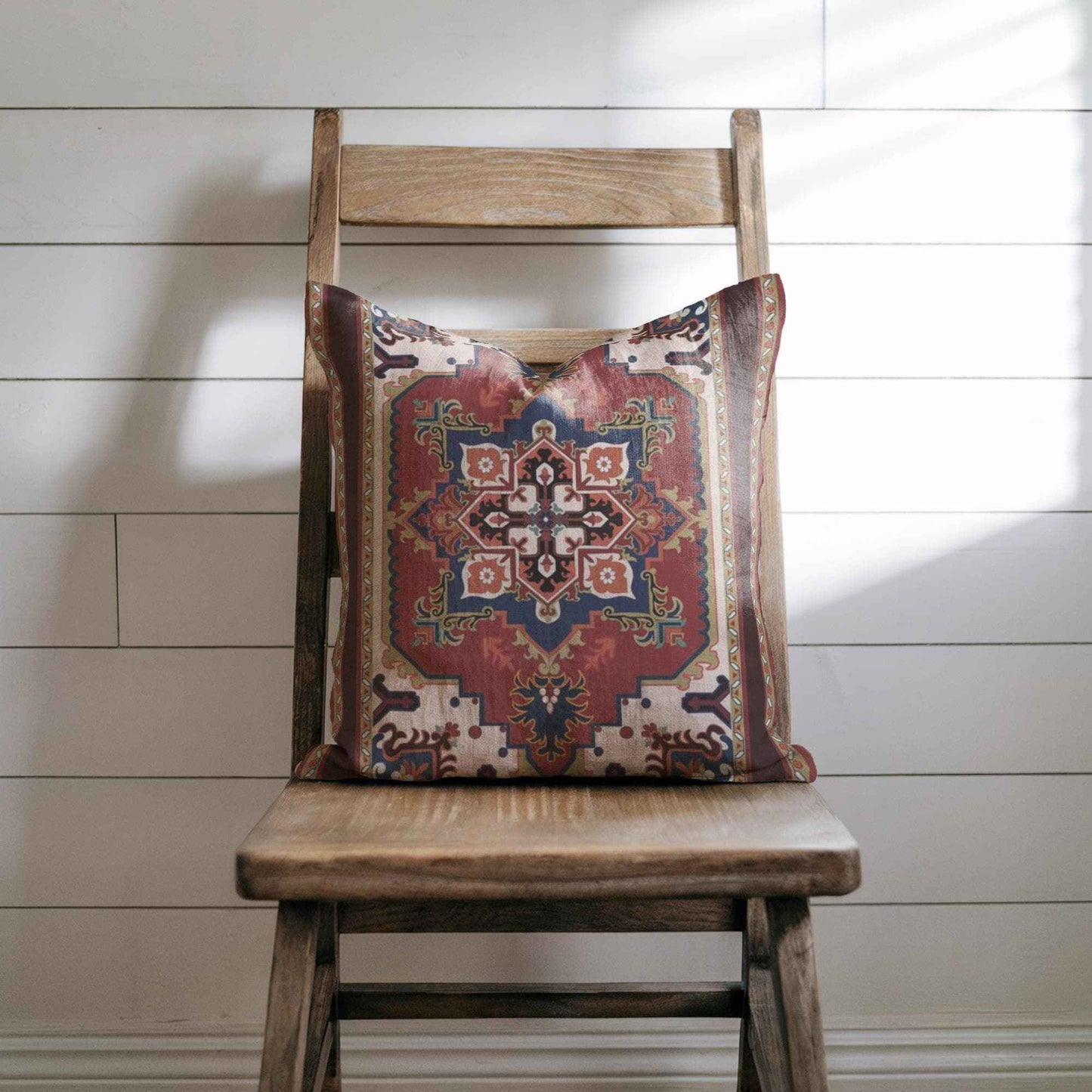 Caucasian Rug Inspired pillow cover with geometric pattern styled on a sofa or bed
