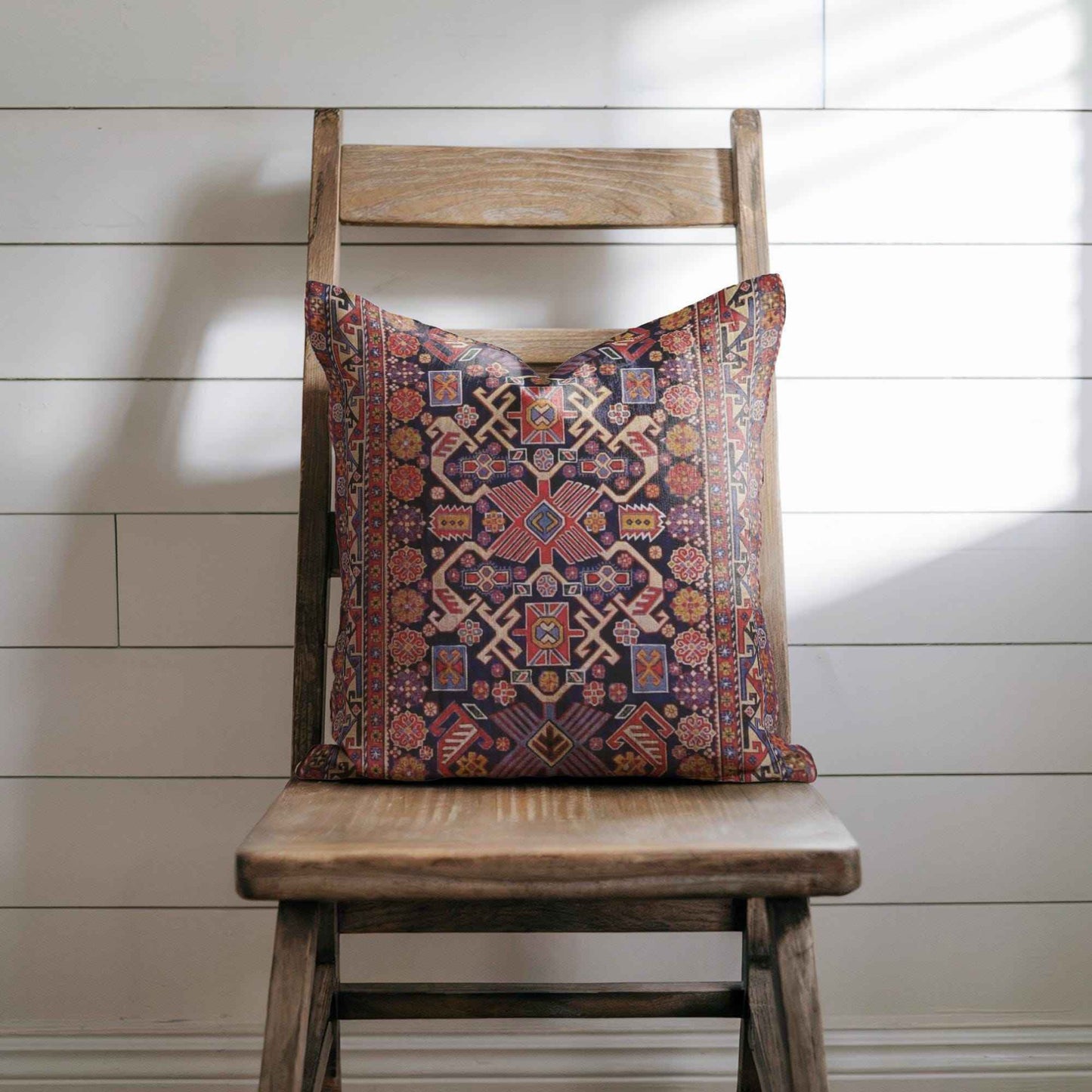 Anatolian Inspired throw pillow with rug-style pattern styled on a sofa or bed