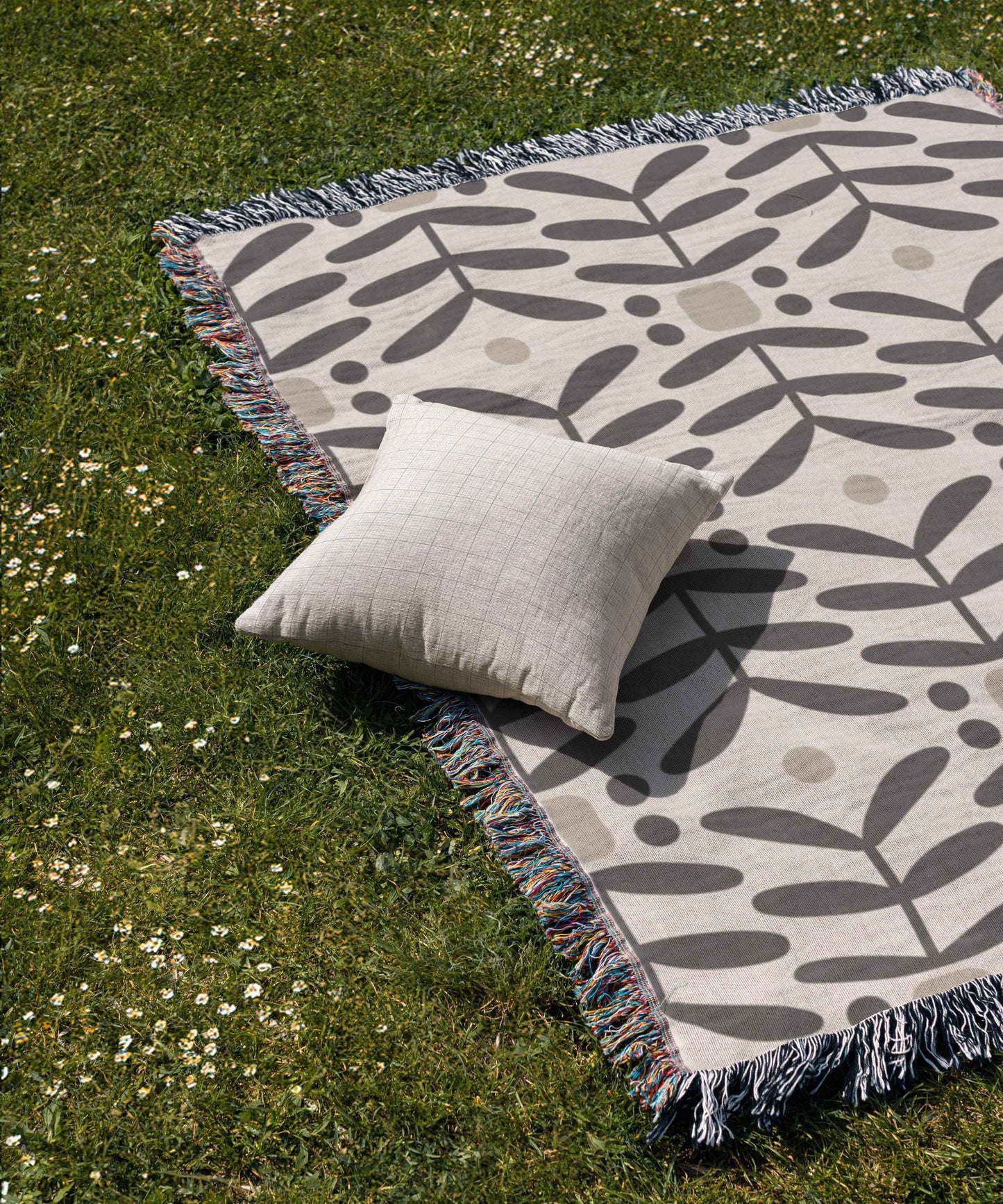 Scandinavian Inspired woven blanket with woven pattern styled for layered home decor