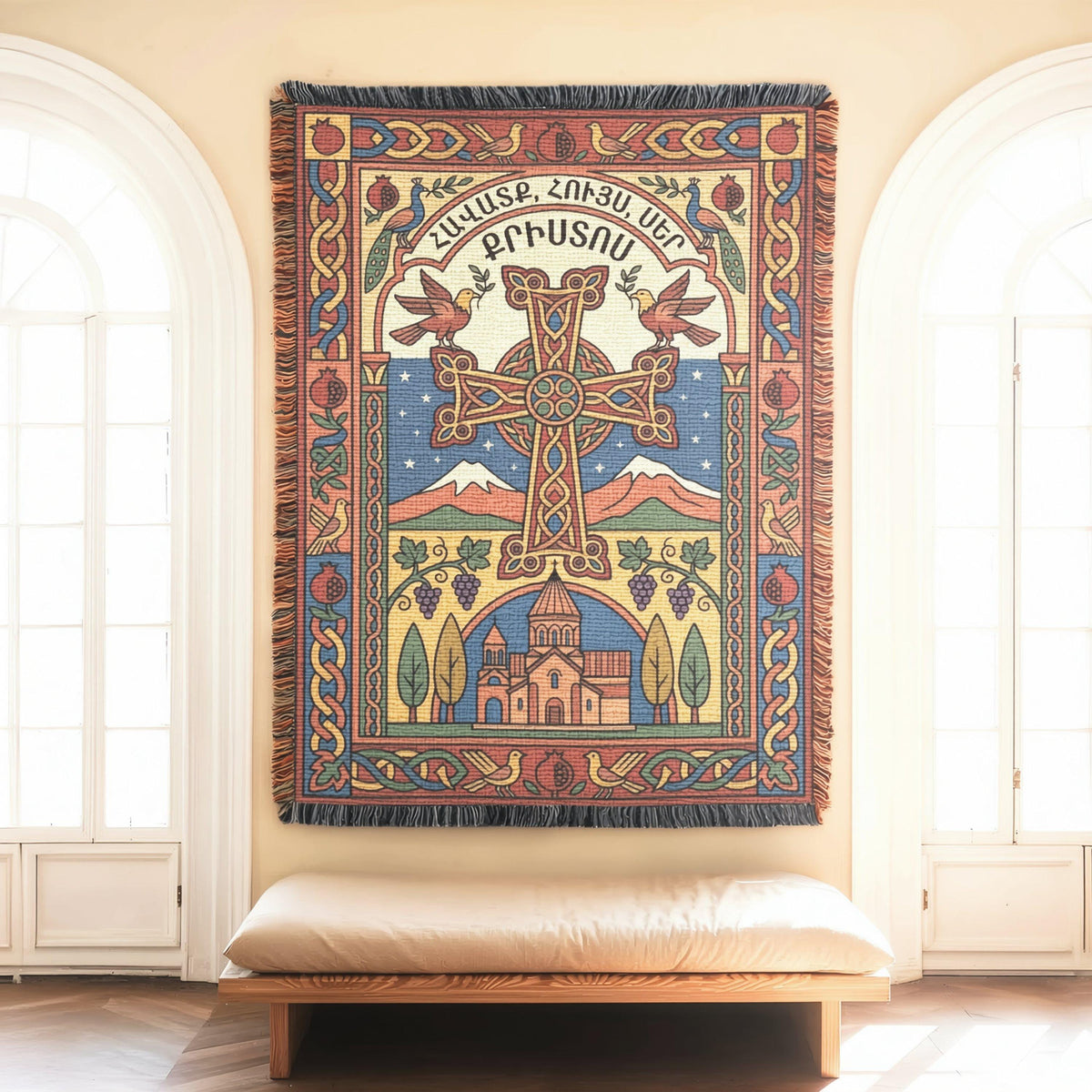 Armenian cross wall tapestry with Faith, Hope, Love lettering, hung above a cushioned bench between arched windows