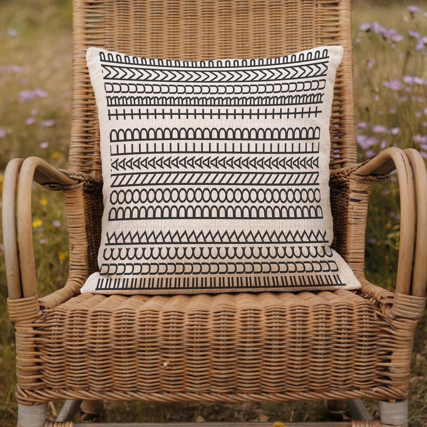 Modern Geometric throw pillow with geometric pattern styled on a sofa or bed