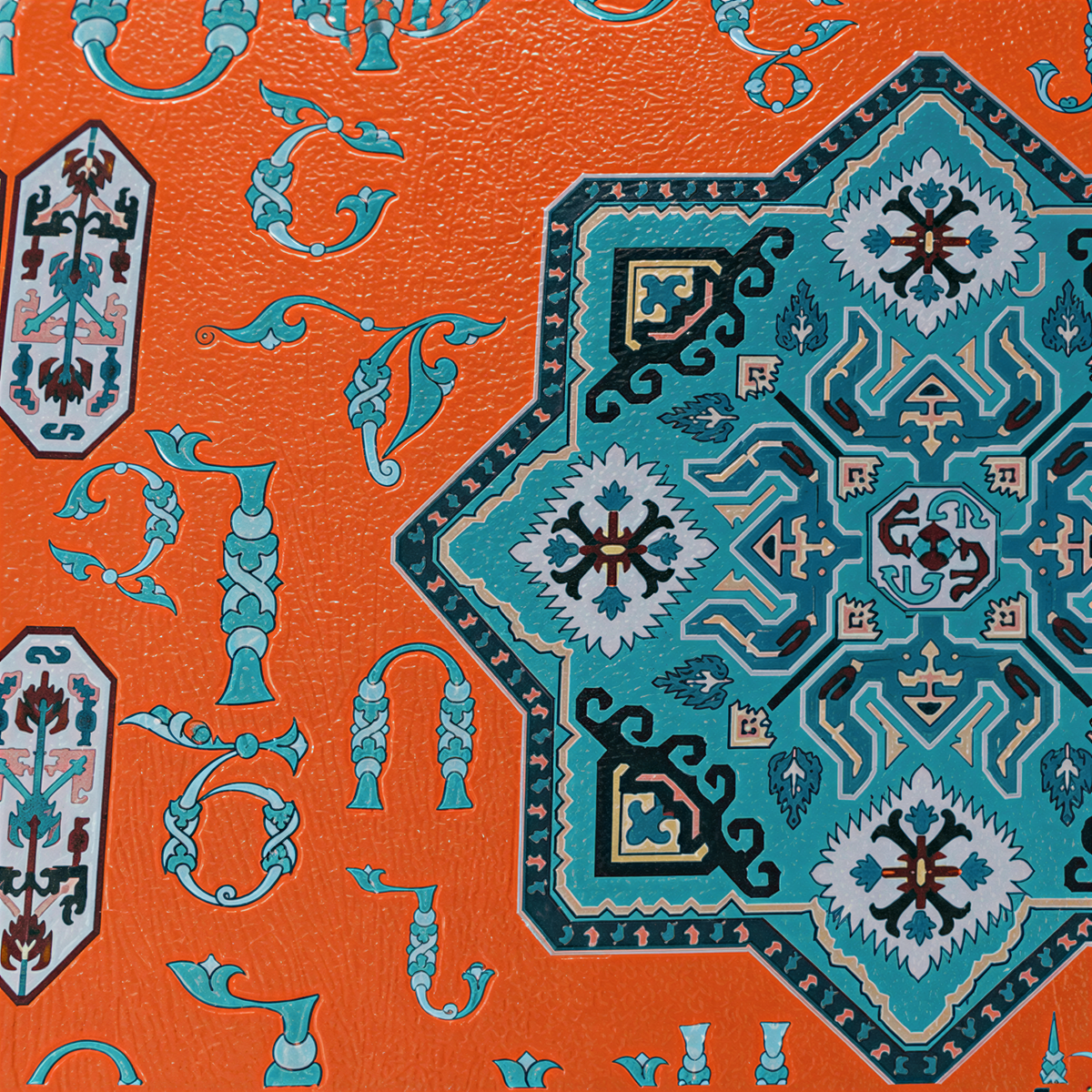 Close view of the turquoise eight-point medallion and Armenian ornament on orange