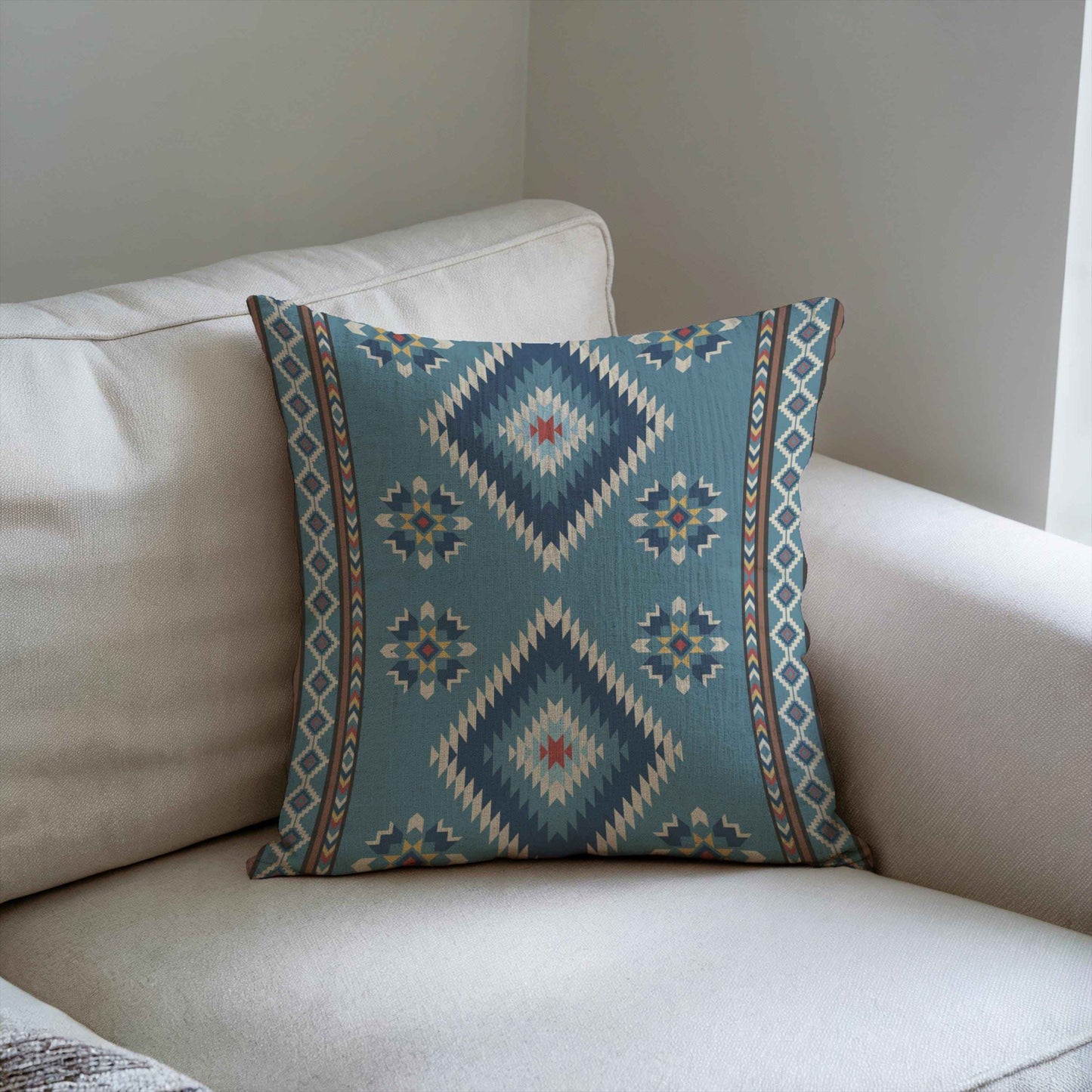 Southwestern throw pillow with geometric pattern styled on a sofa or bed