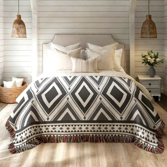Southwestern woven blanket with geometric pattern styled for layered home decor