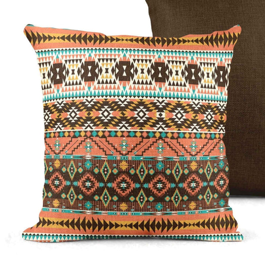 Southwestern throw pillow with geometric pattern styled on a sofa or bed