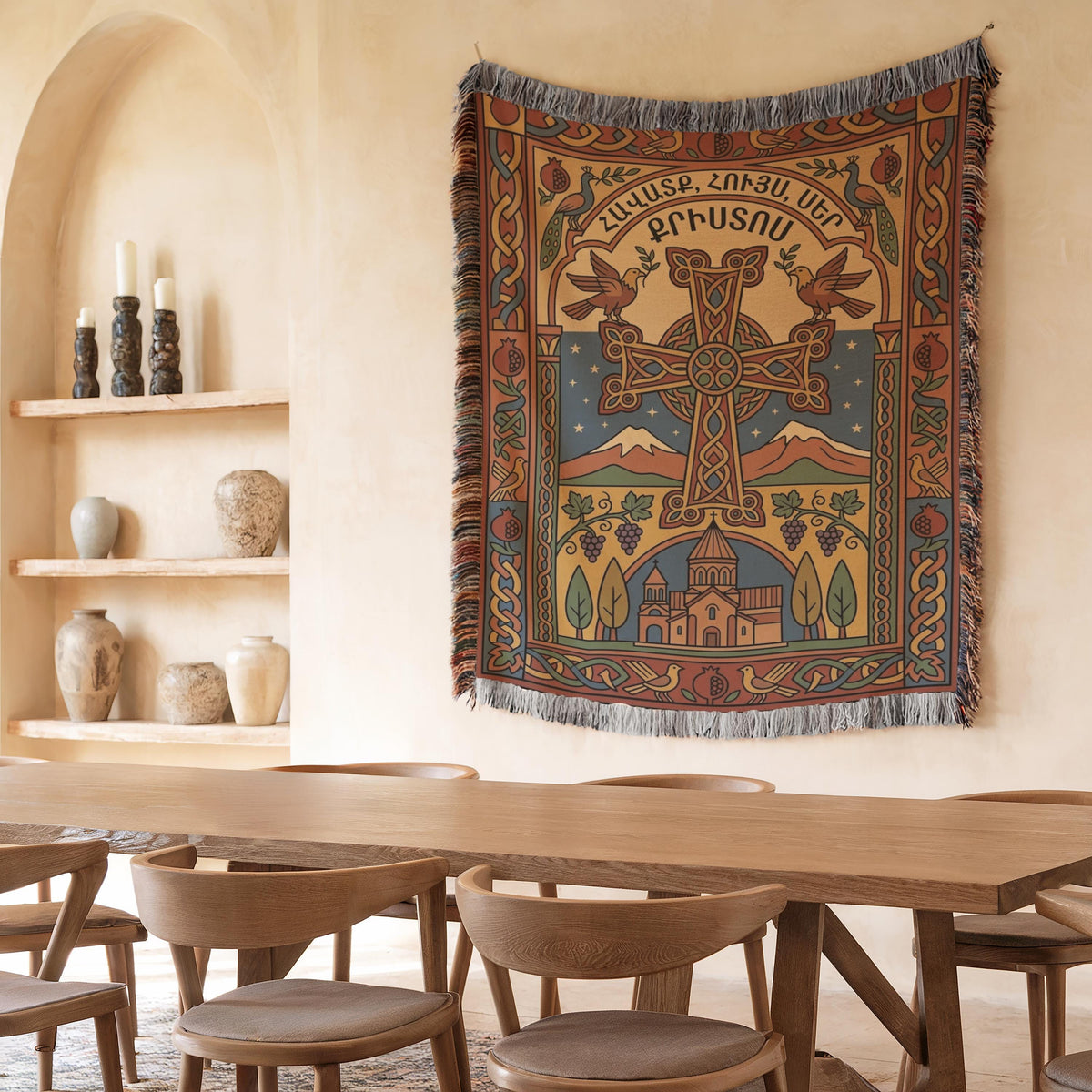 Armenian cross wall tapestry hung above a wooden dining table beside shelves of ceramic vases