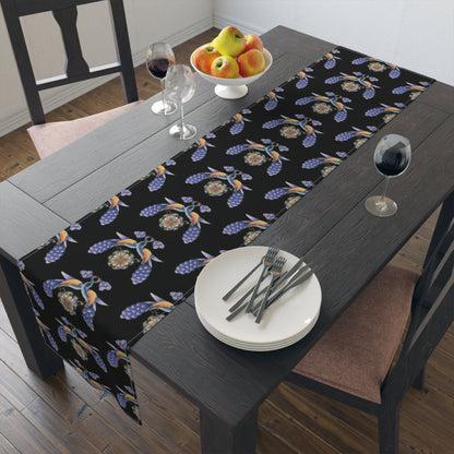 Black Armenian bird and flower table runner shown on a dining table