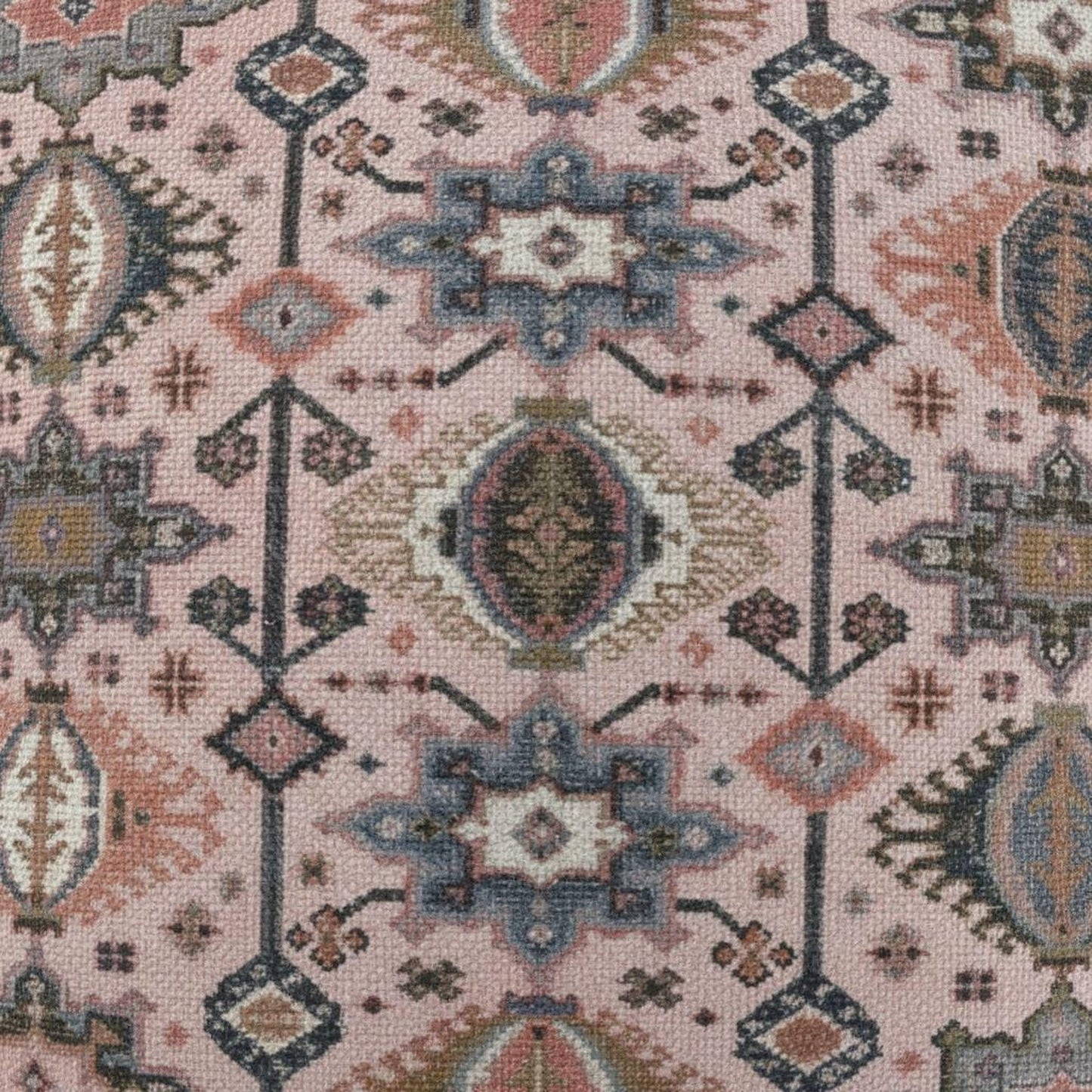 Anatolian Inspired throw pillow with rug-style pattern styled on a sofa or bed