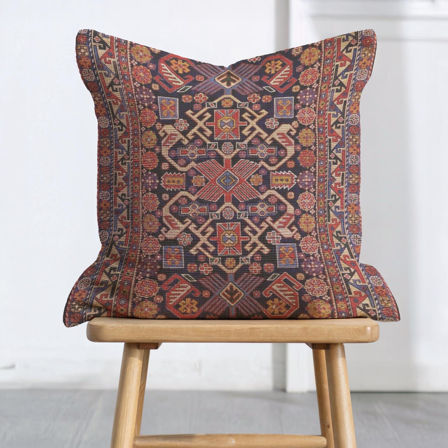 Anatolian Inspired throw pillow with rug-style pattern styled on a sofa or bed