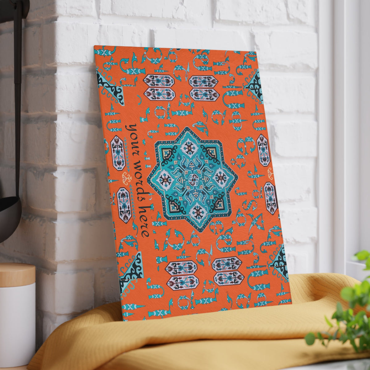 Orange and turquoise Armenian cutting board on a kitchen surface with herbs and stones nearby