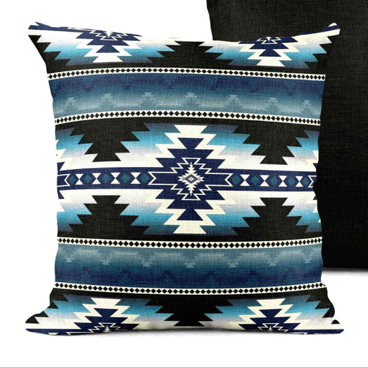 Southwestern throw pillow with geometric pattern styled on a sofa or bed