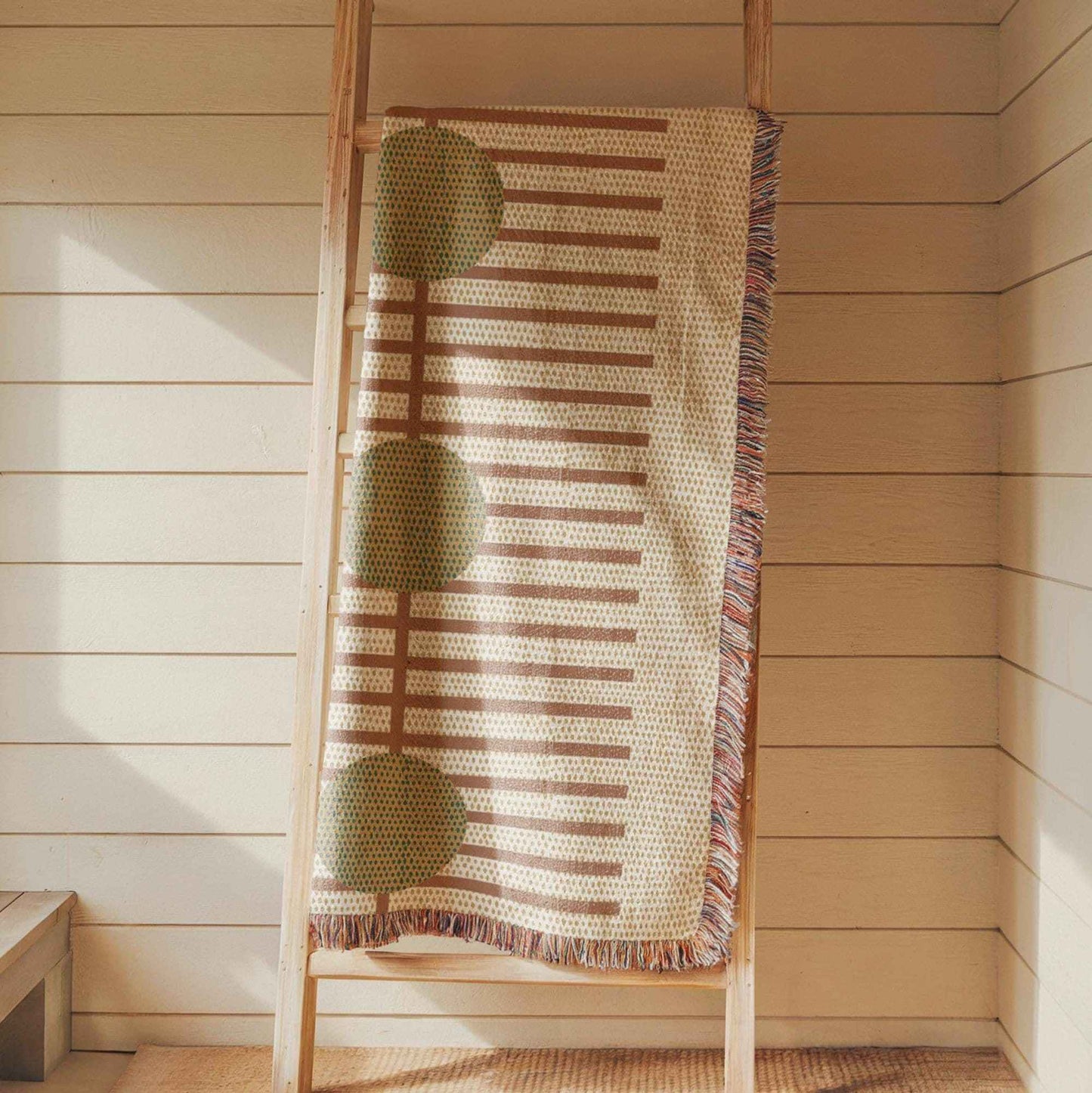 Scandinavian Inspired woven blanket with woven pattern styled for layered home decor