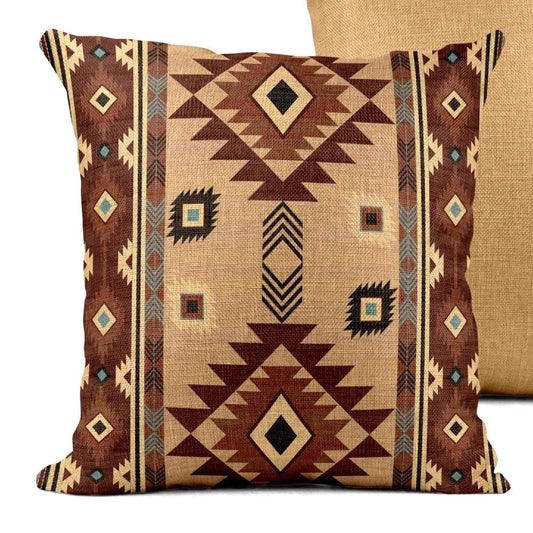 Southwestern throw pillow with geometric pattern styled on a sofa or bed