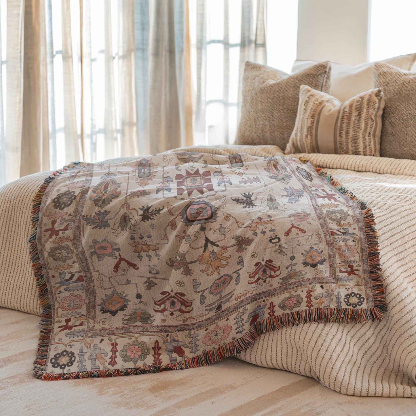 Anatolian Inspired woven blanket with rug-style pattern styled for layered home decor