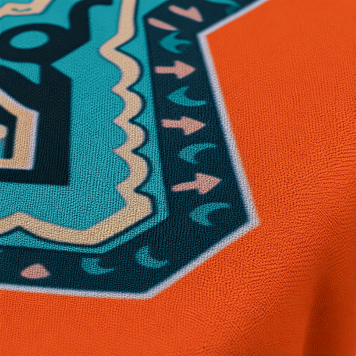 Close view of the turquoise medallion edge against the warm orange ground