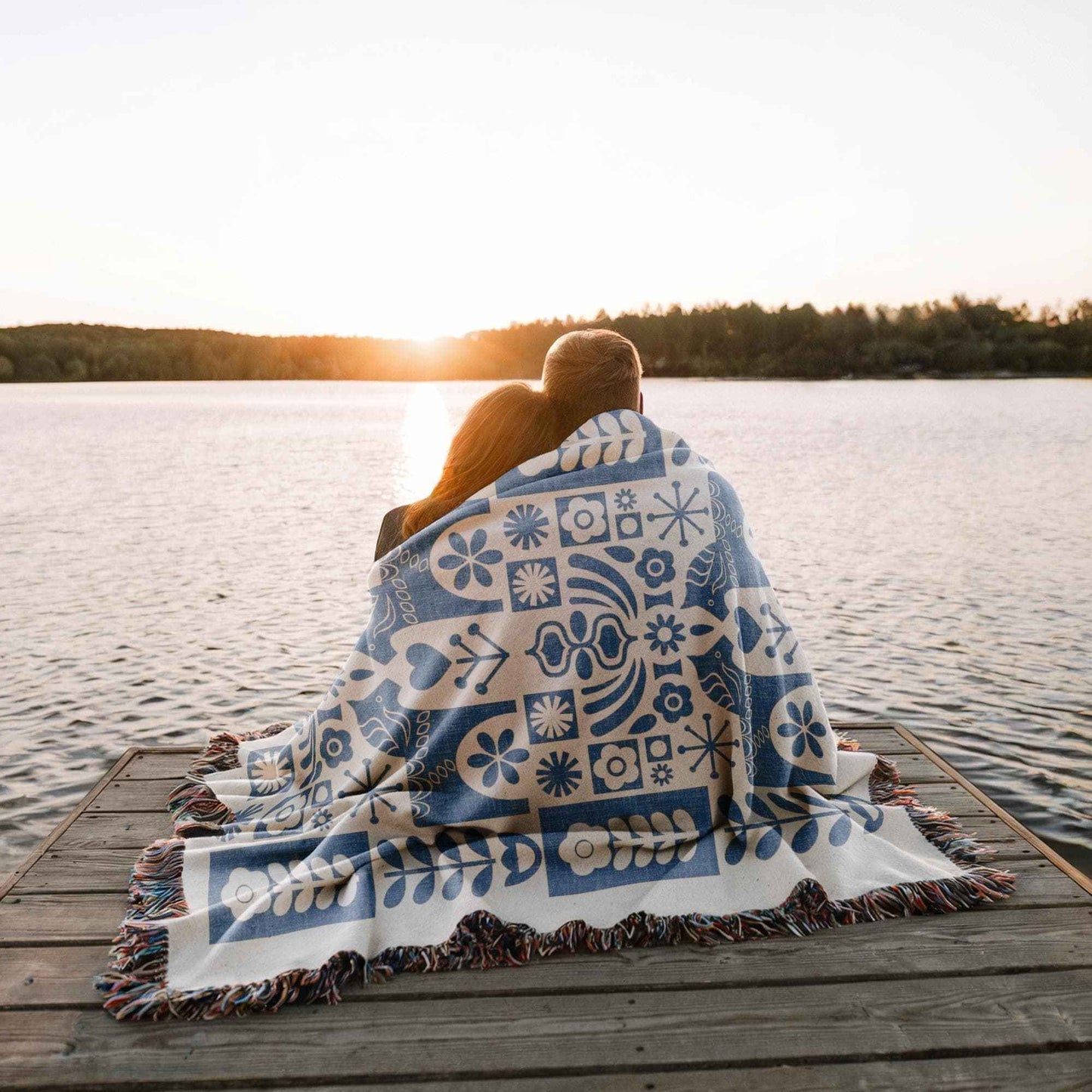 Scandinavian Inspired woven blanket with rug-style pattern styled for layered home decor