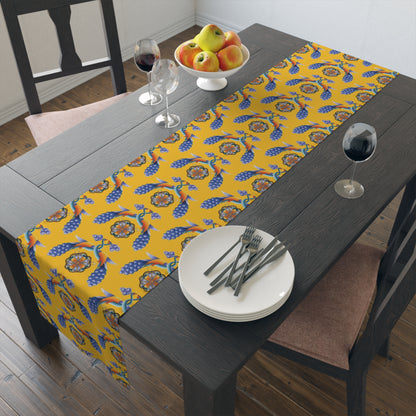Yellow Armenian bird table runner being laid on a dining table