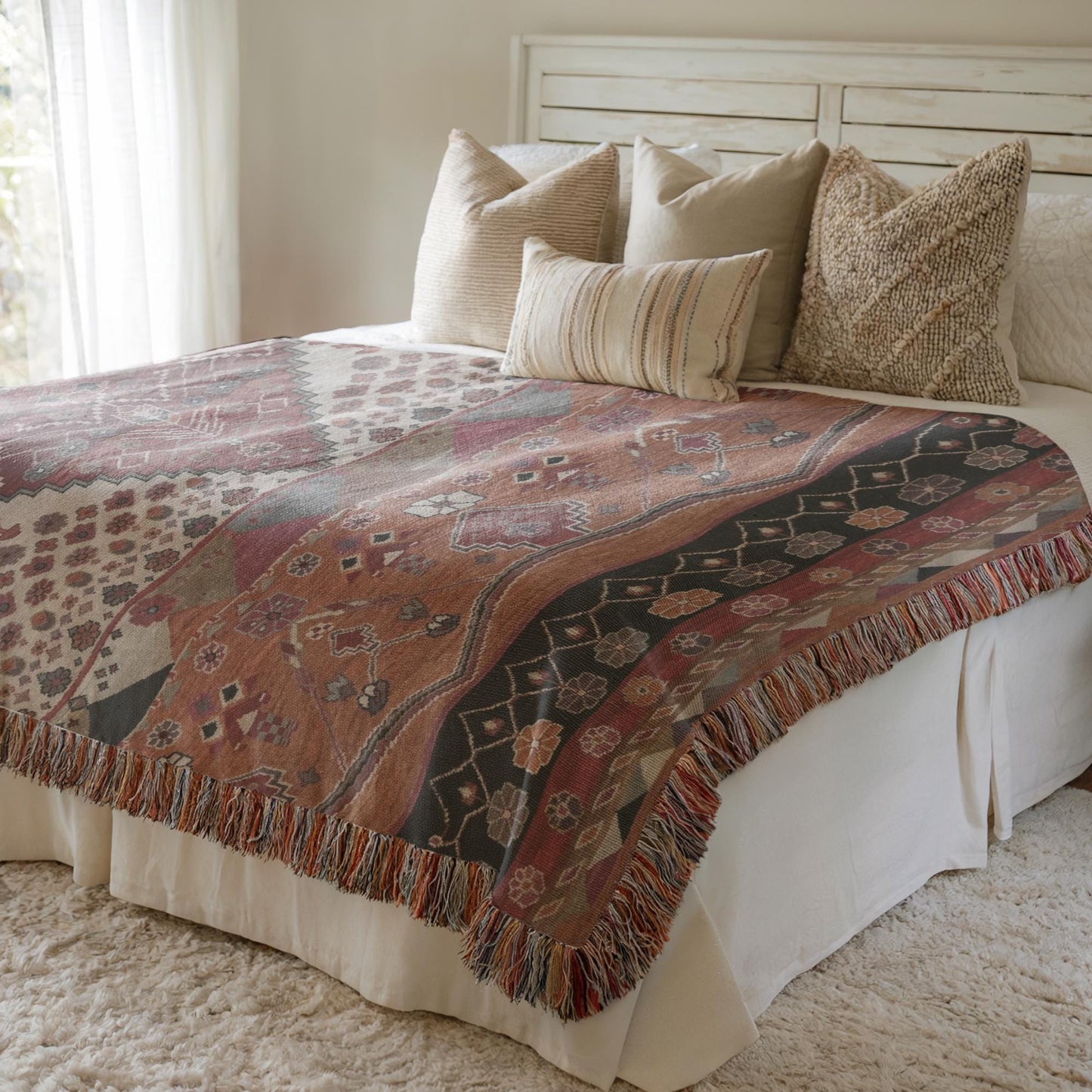 Southwestern woven blanket with geometric pattern styled for layered home decor