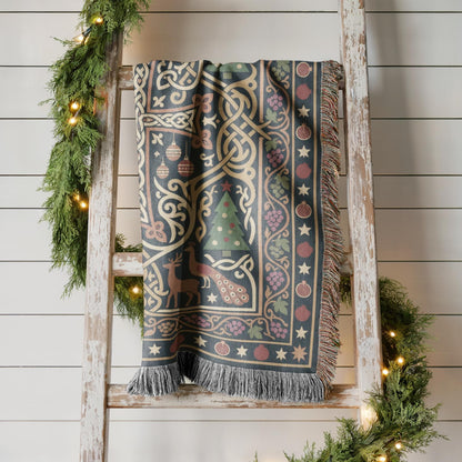 Armenian Christmas woven cotton blanket with fringe. A cream-and-muted-gold Armenian-style cross stands against a dark green field. Interlaced ornament, pomegranates and small stars frame the cross, with burgundy accents along the border.