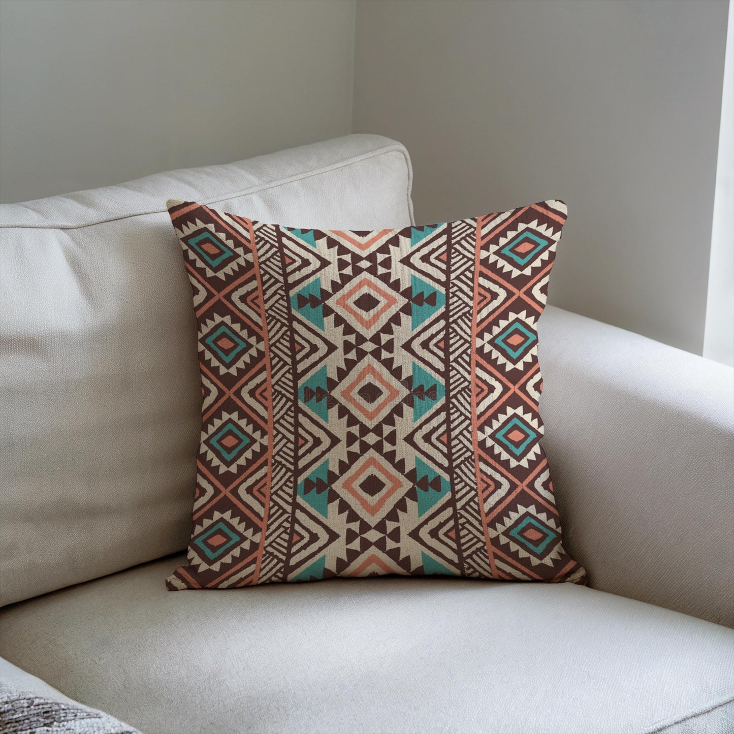 Southwestern pillow cover with geometric pattern styled on a sofa or bed