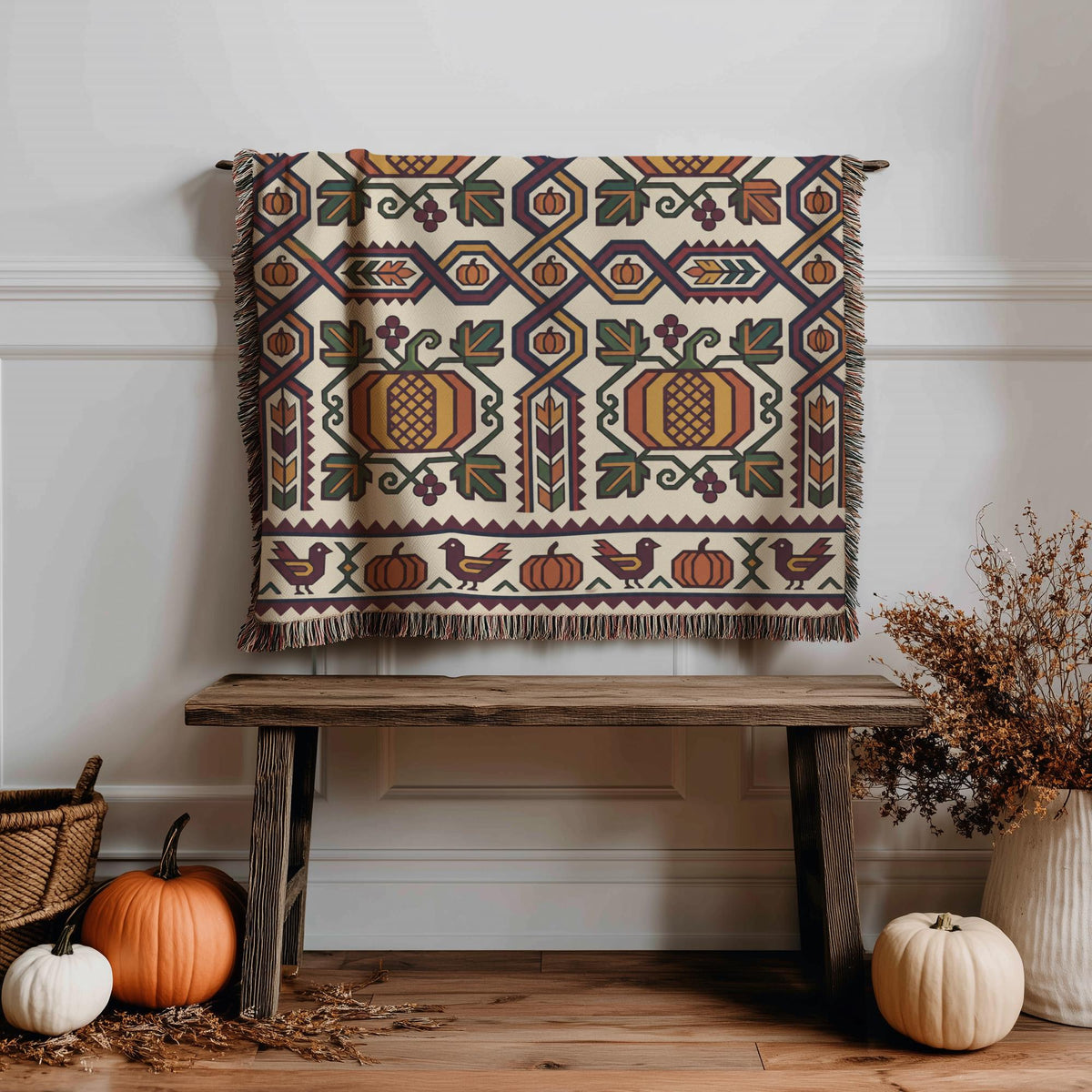Geometric Ghapama blanket hung above a wooden bench with a basket