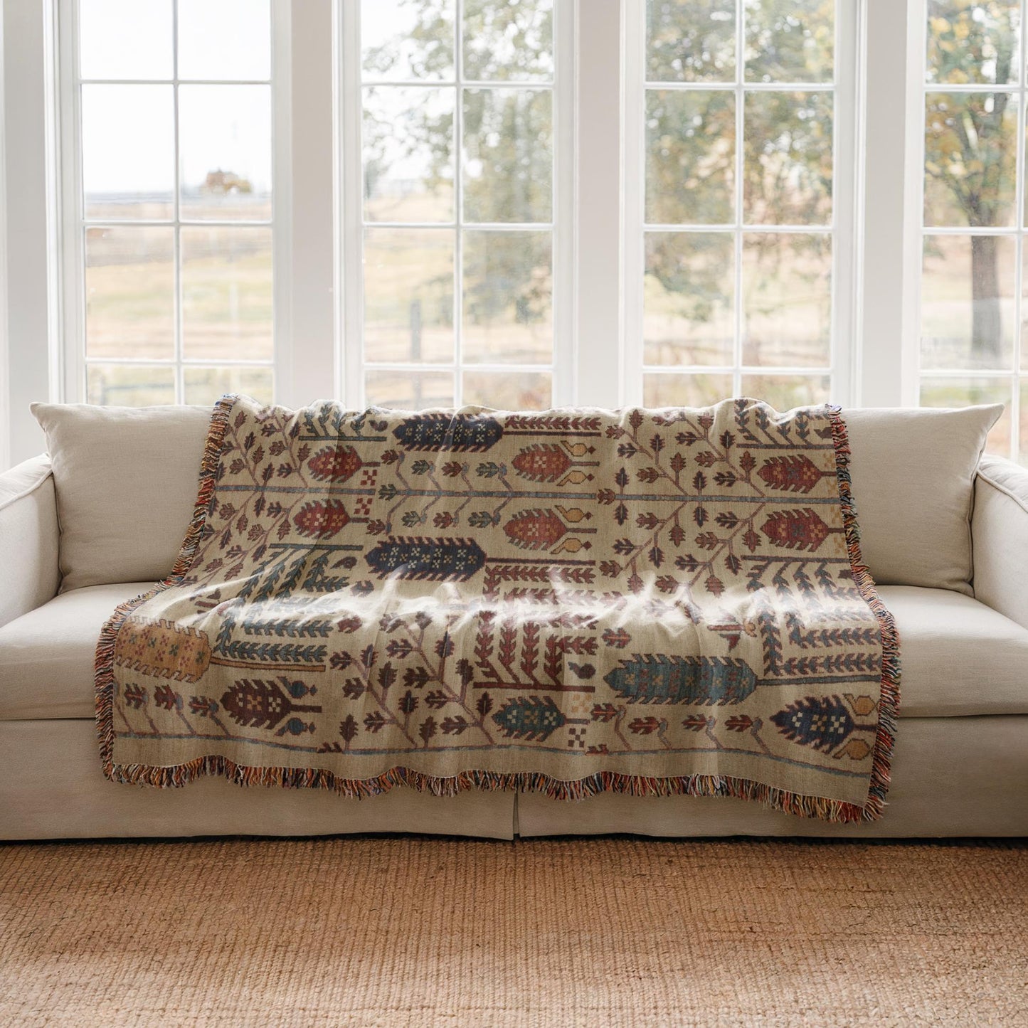 Anatolian Inspired woven blanket with rug-style pattern styled for layered home decor