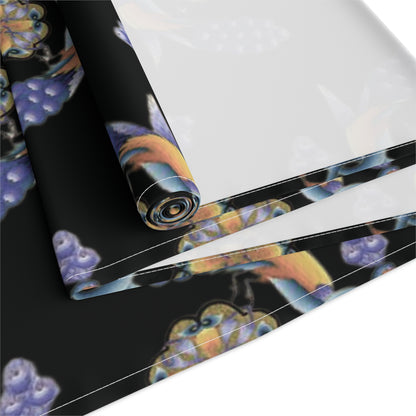 Black Armenian bird and flower table runner shown on a dark wood dining table